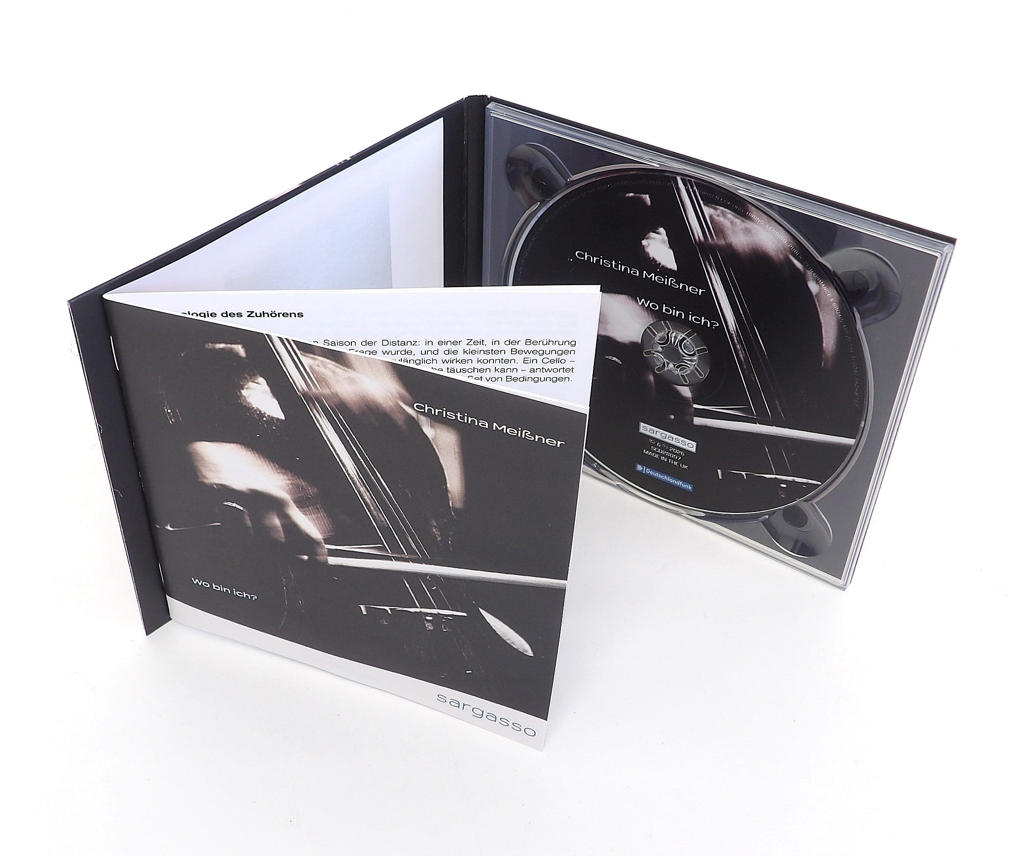 A sample of a CD Digipack product with a 12 page booklet adhere to the inside cover