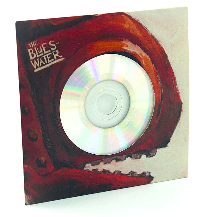 CD in Vinyl imitation wallet packaging by Alpha Duplication