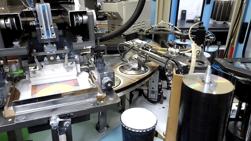Inside the Screen Printing and CD loading chamber of a CD lithographic printing machine